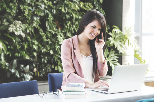 Business woman using VoIP