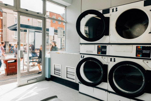 Industrial washing machines at a laundromat