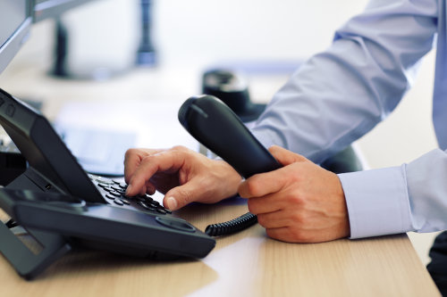 Businessman using cloud-based VoIP