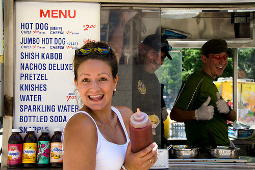 Hot dog truck and the happy customer