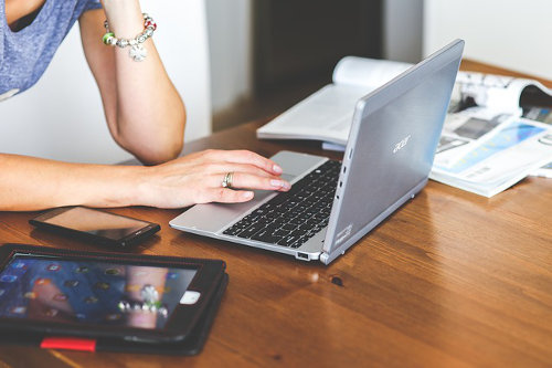 An entrepreneur works on additional income for her business