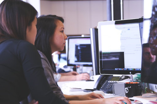Business people using IT solutions