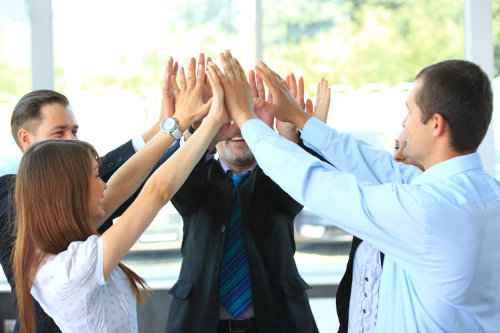 Happy employees high-five