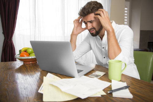 Stressed out business owners doing accouting
