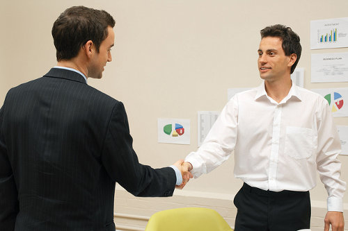 Bilingual employee negotiates with client