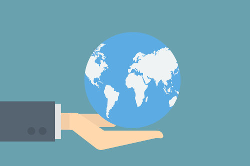 Businessman holding globe
