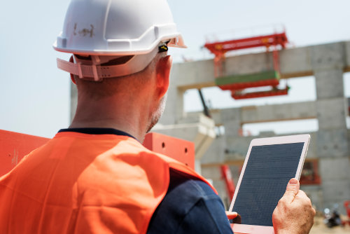Construction worker using tablet PC