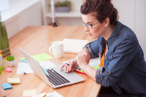 Small business owner using productivity apps