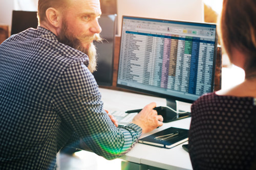 Business owner using spreadsheets
