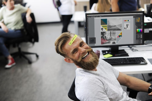 Happy employee, smiling broadly