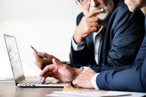 Businessmen using ERP system