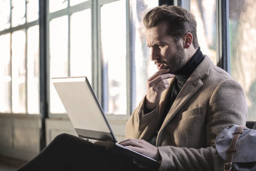 Businessman taking courses online