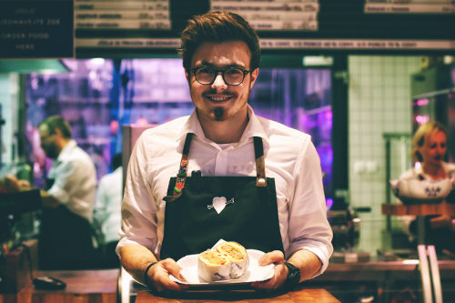 Restaurant manager promoting dishes