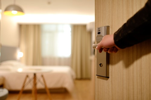 Businessman entering hotel room