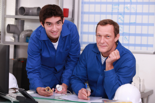 Two managers planning work schedule