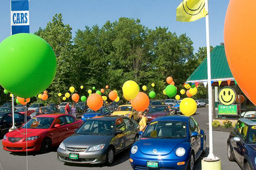 Colorful balloons on car lot