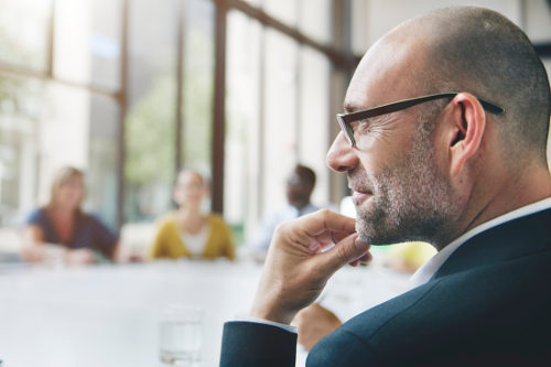 Emphatetic manager observing team meeting