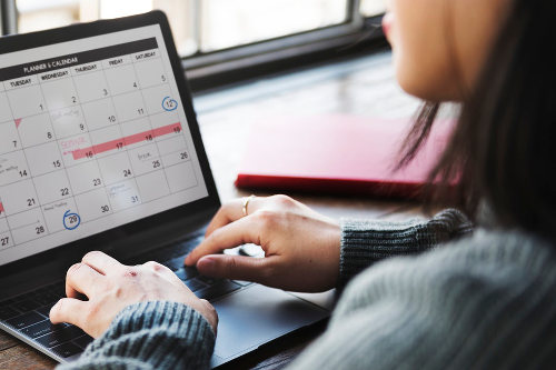 Businesswoman using event planning software