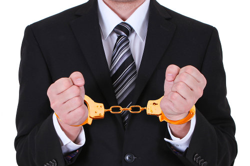 Salesman with golden handcuffs