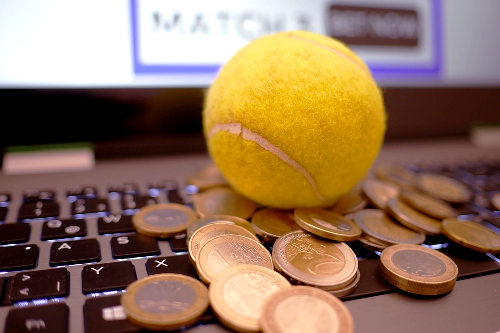 Tennis ball and coins
