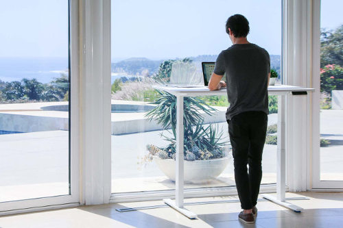 Businessman using standing desk