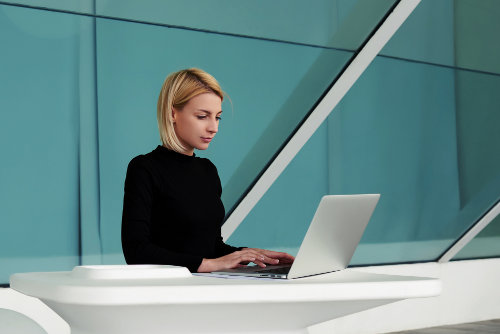 Businesswoman using laptop