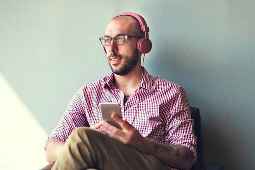 Businessman listening to MP3