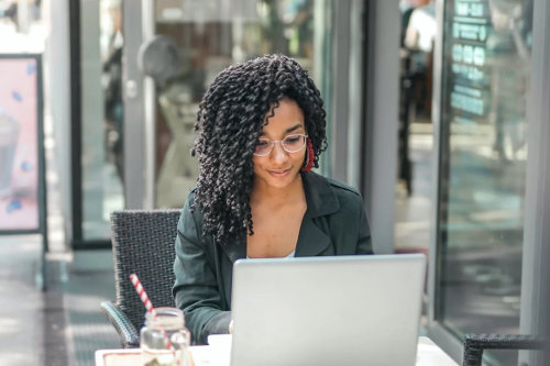 Startup founder running her business from laptop