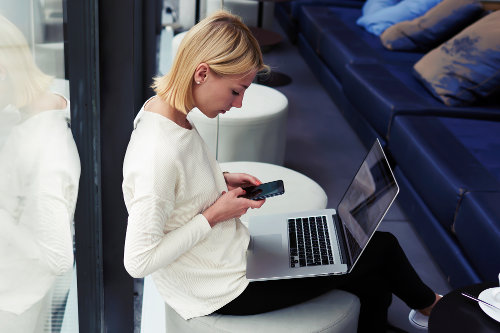 Businesswoman downloading Instagram content