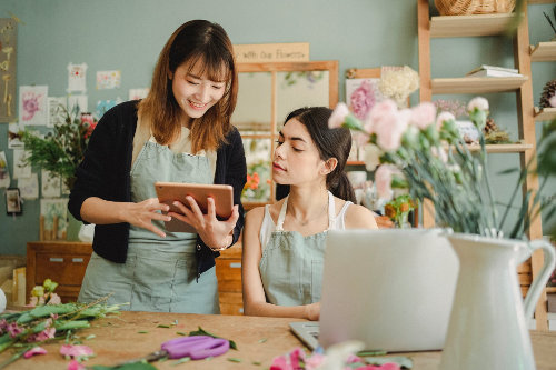 Small business owners managing orders