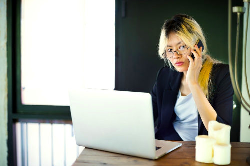 Businesswoman using tech