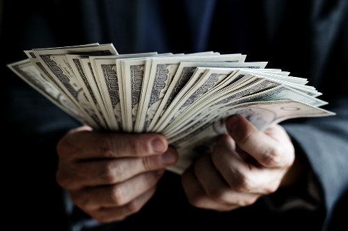 Cash - invest or pay off debts?