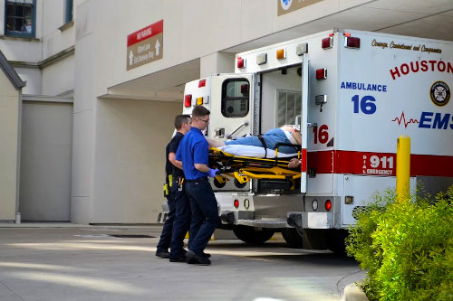 First responders helping a person injured at work