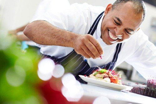 Kitchen staff preparing meals for event
