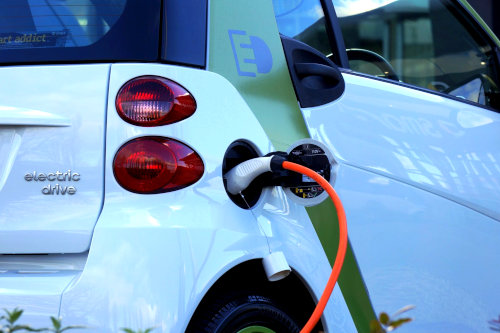 Electric car charging at an EV changing station