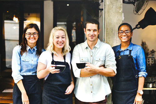Restaurant owner and his staff