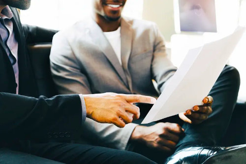 Businessmen reviewing business proposal