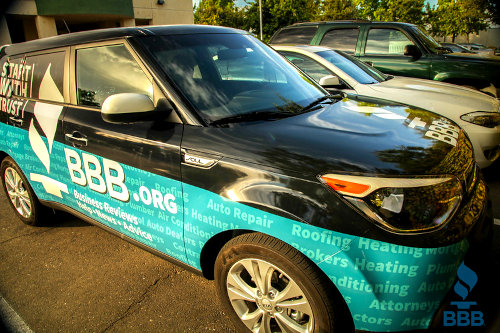 Car wrapped with ads