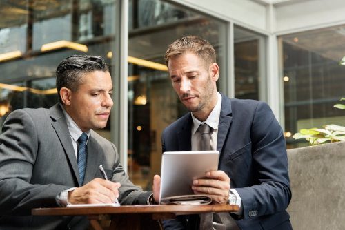 Businessmen using CRM solution