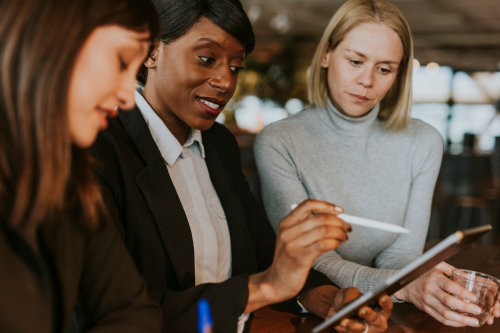 Businesswomen using CRM solutions