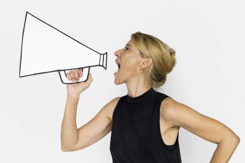 Promoting business using megaphone.