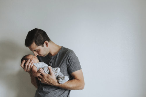 Young father holding his baby