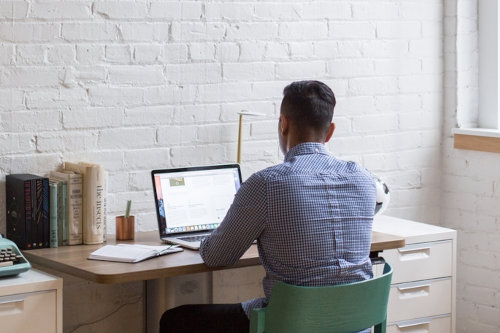 Businessman using small business software solutions