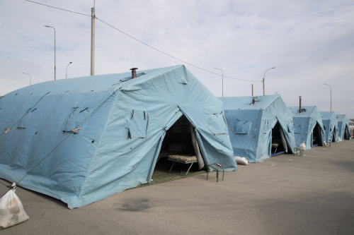 Insulated fabric shelter for mobile building purpose