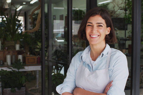 Small business owner in front of business space